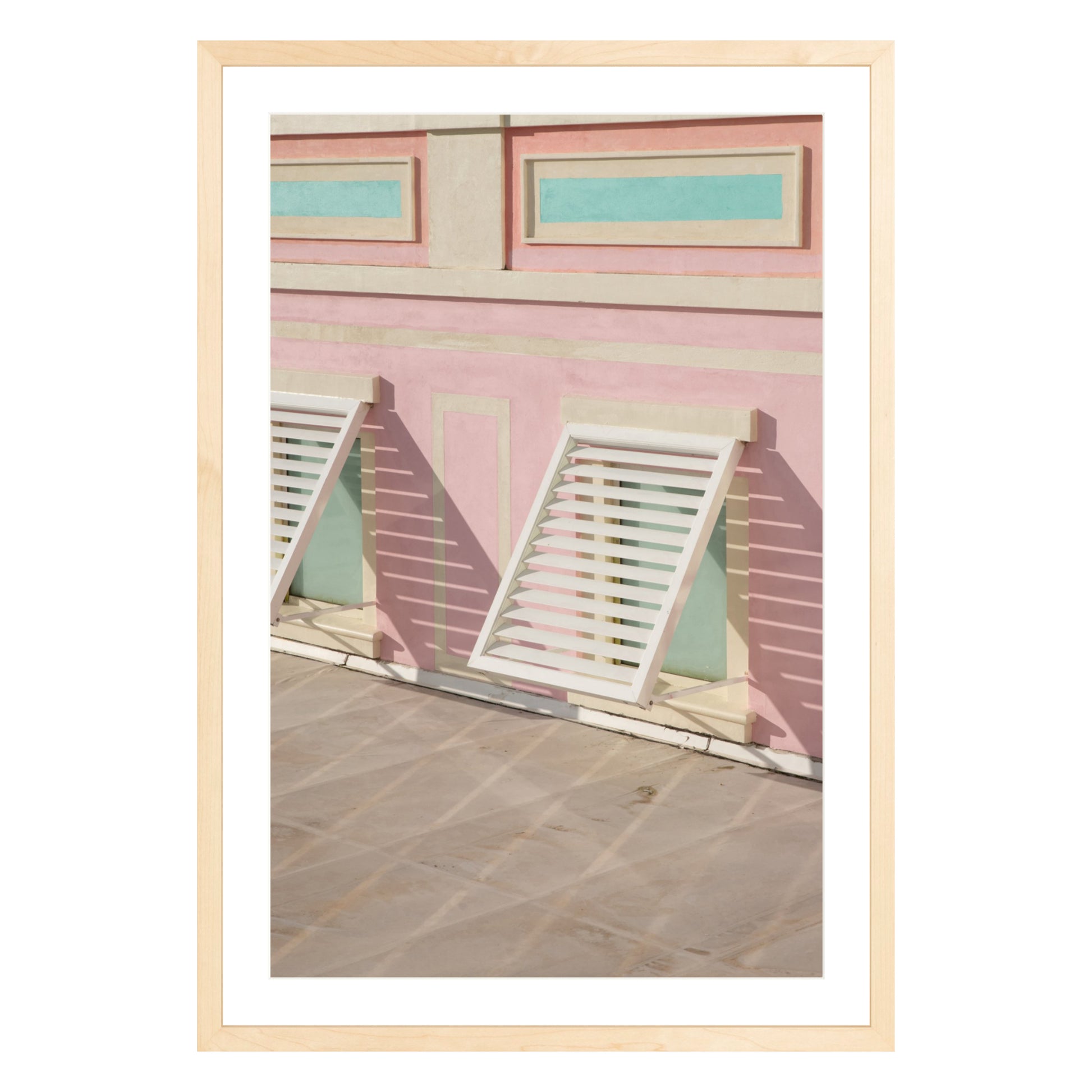 Photograph of colorful geometric building with open window shades in Baha Mar, Bahamas framed in natural wood with white mat
