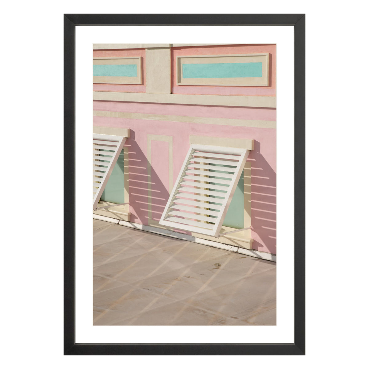 Photograph of colorful geometric building with open window shades in Baha Mar, Bahamas framed in black with white mat