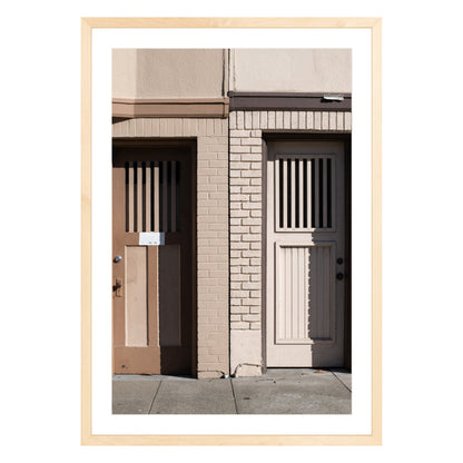 Photograph of two doors in San Francisco framed in natural wood with white mat