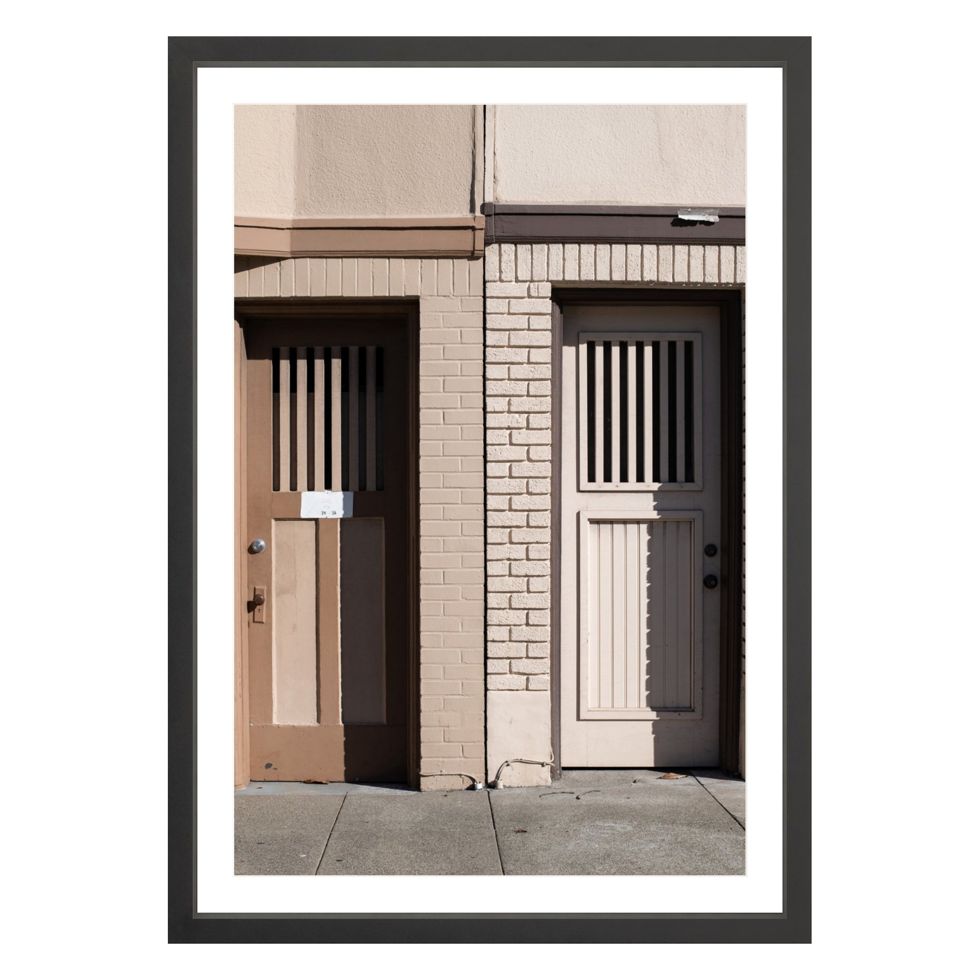 Photograph of two doors in San Francisco framed in black with white mat