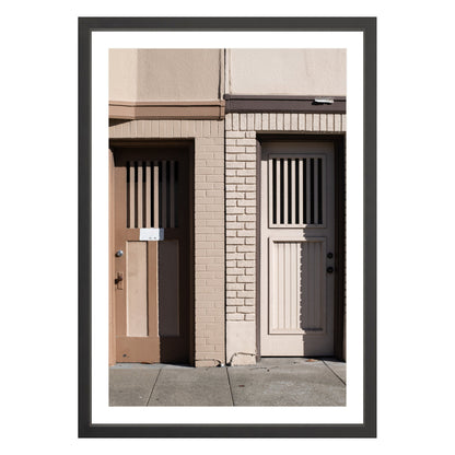 Photograph of two doors in San Francisco framed in black with white mat