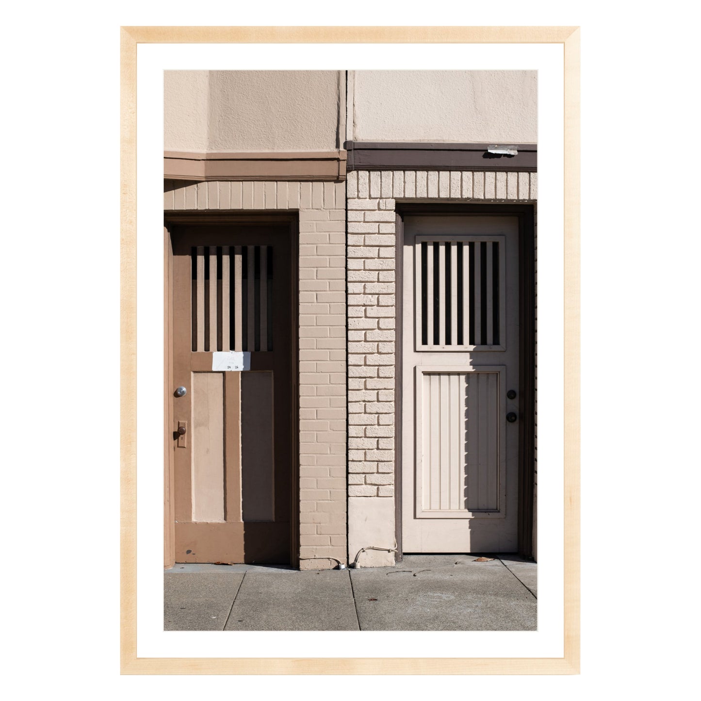 Photograph of two doors in San Francisco framed in natural wood with white mat