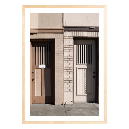 Photograph of two doors in San Francisco framed in natural wood with white mat