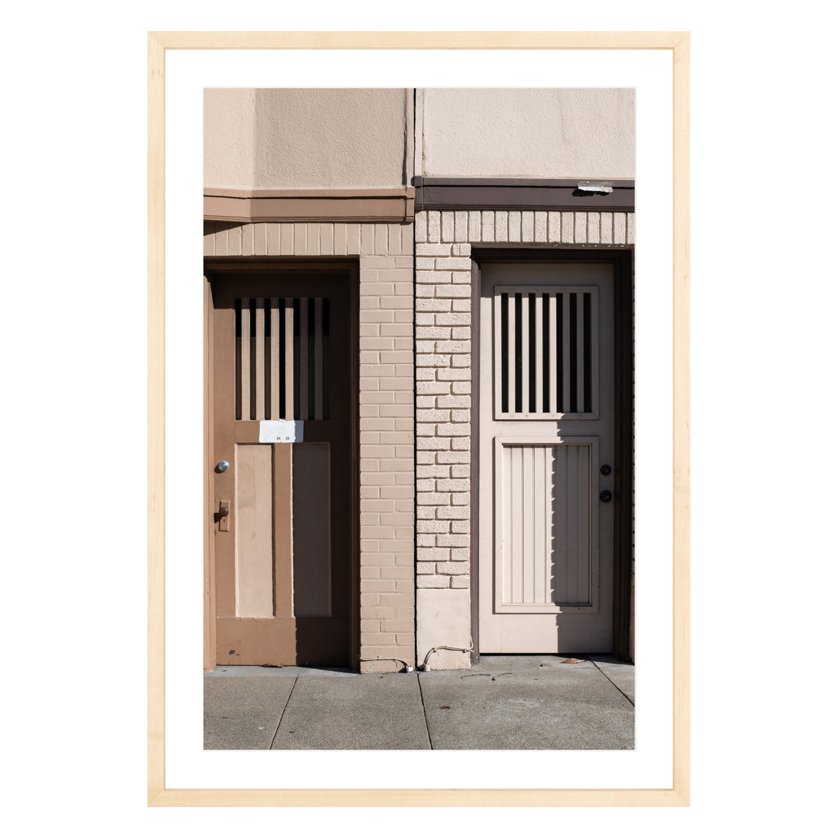 Photograph of two doors in San Francisco framed in natural wood with white mat