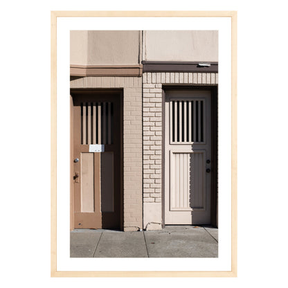 Photograph of two doors in San Francisco framed in natural wood with white mat