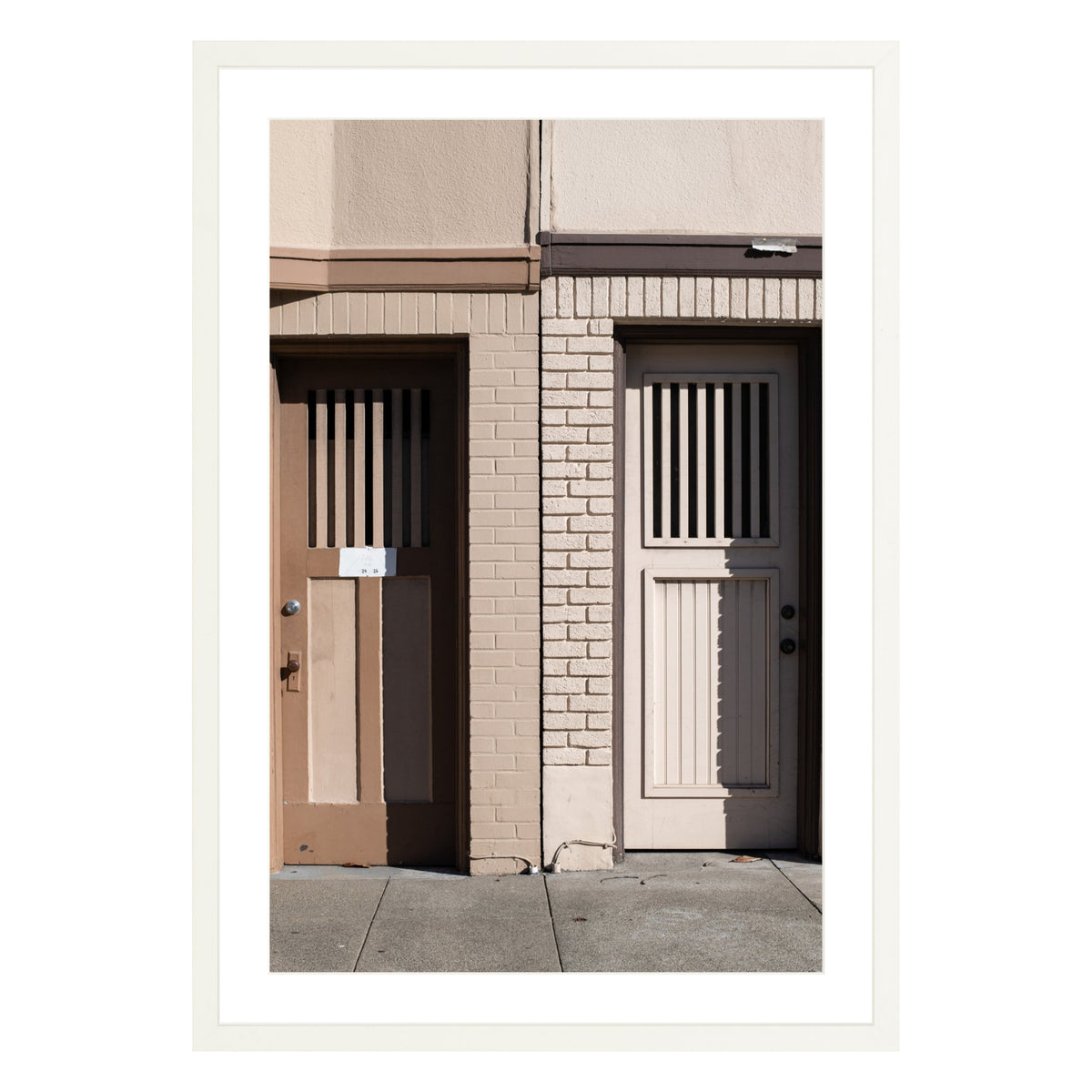 Photograph of two doors in San Francisco framed in white with white mat