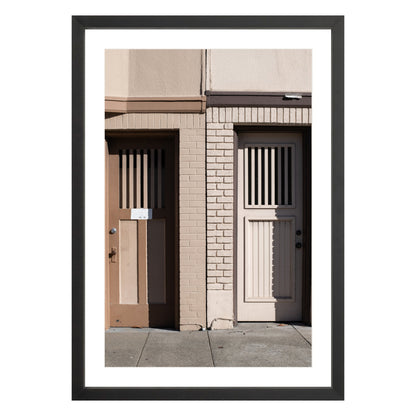 Photograph of two doors in San Francisco framed in black with white mat