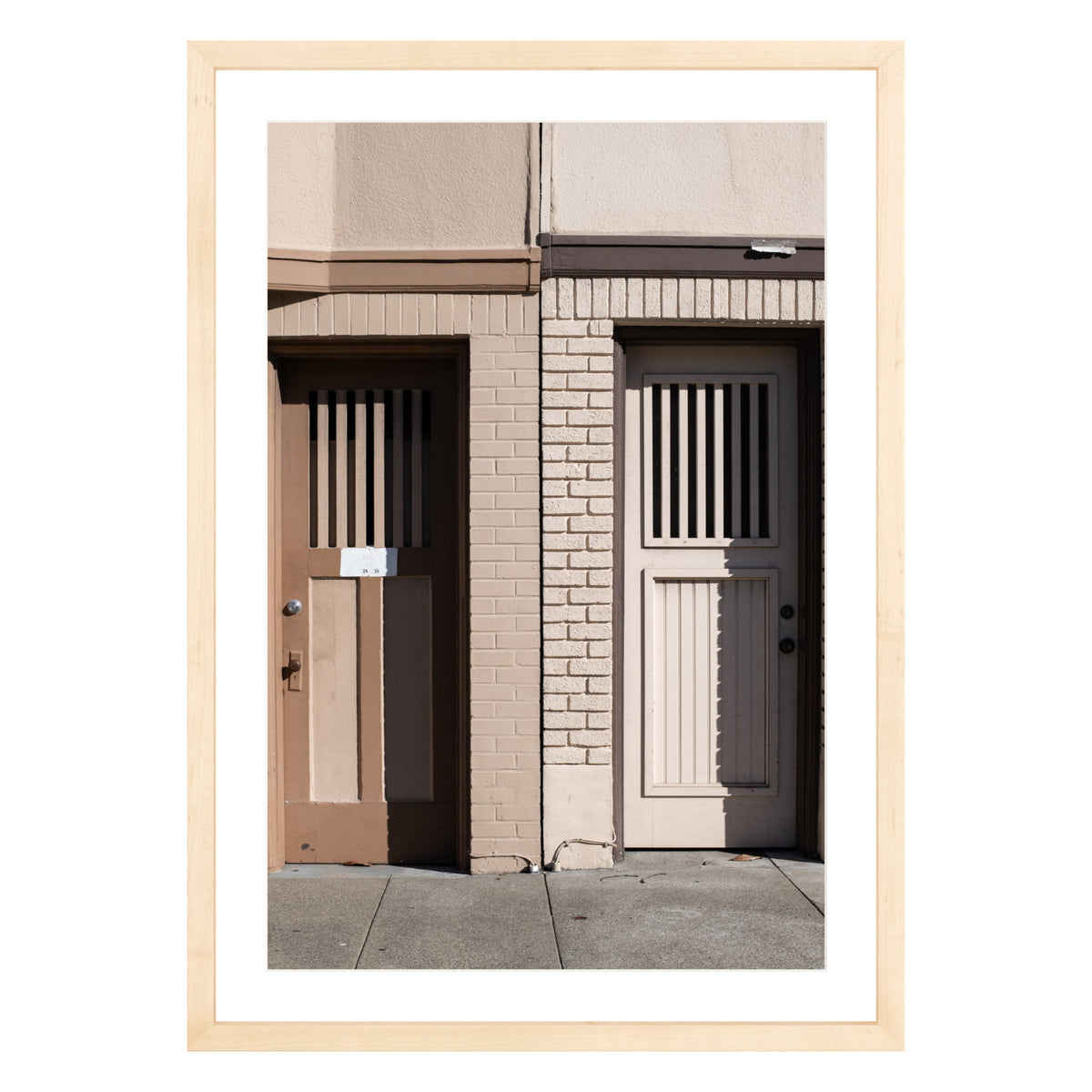 Photograph of two doors in San Francisco framed in natural wood with white mat