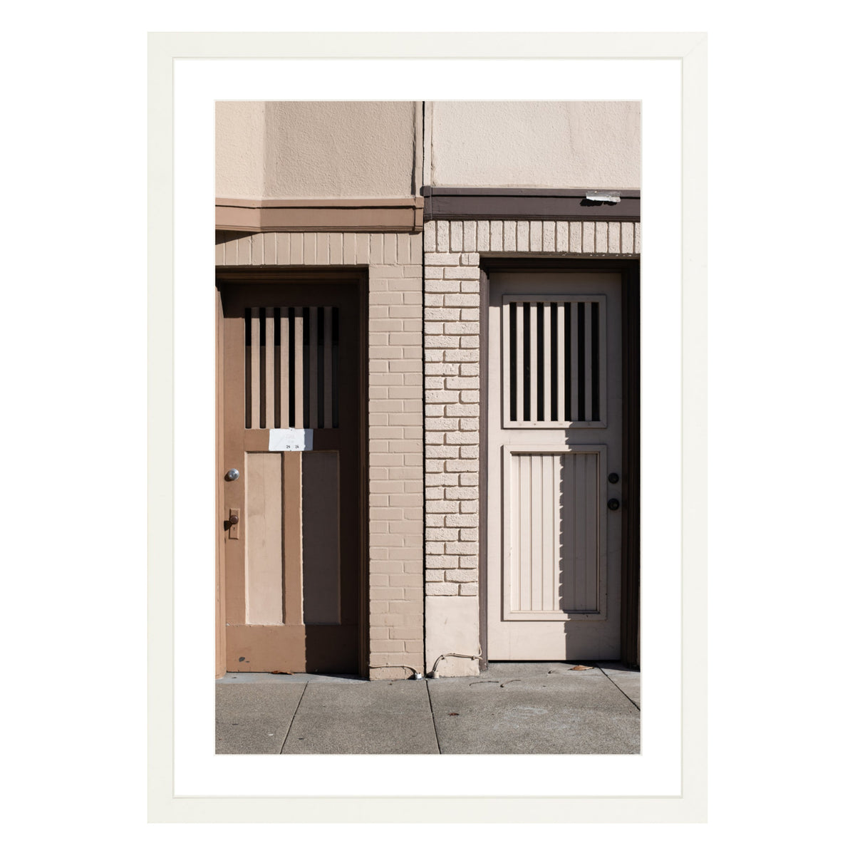 Photograph of two doors in San Francisco framed in white with white mat