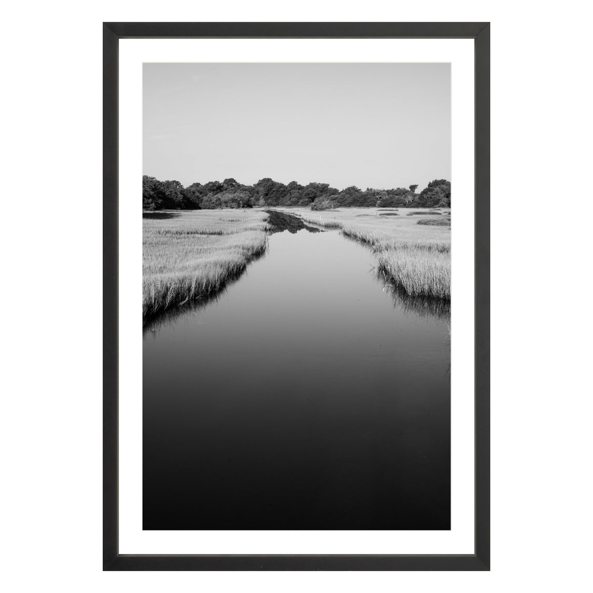 Black and white photograph of a marsh stream on Kiawah Island, South Carolina framed in black with white mat