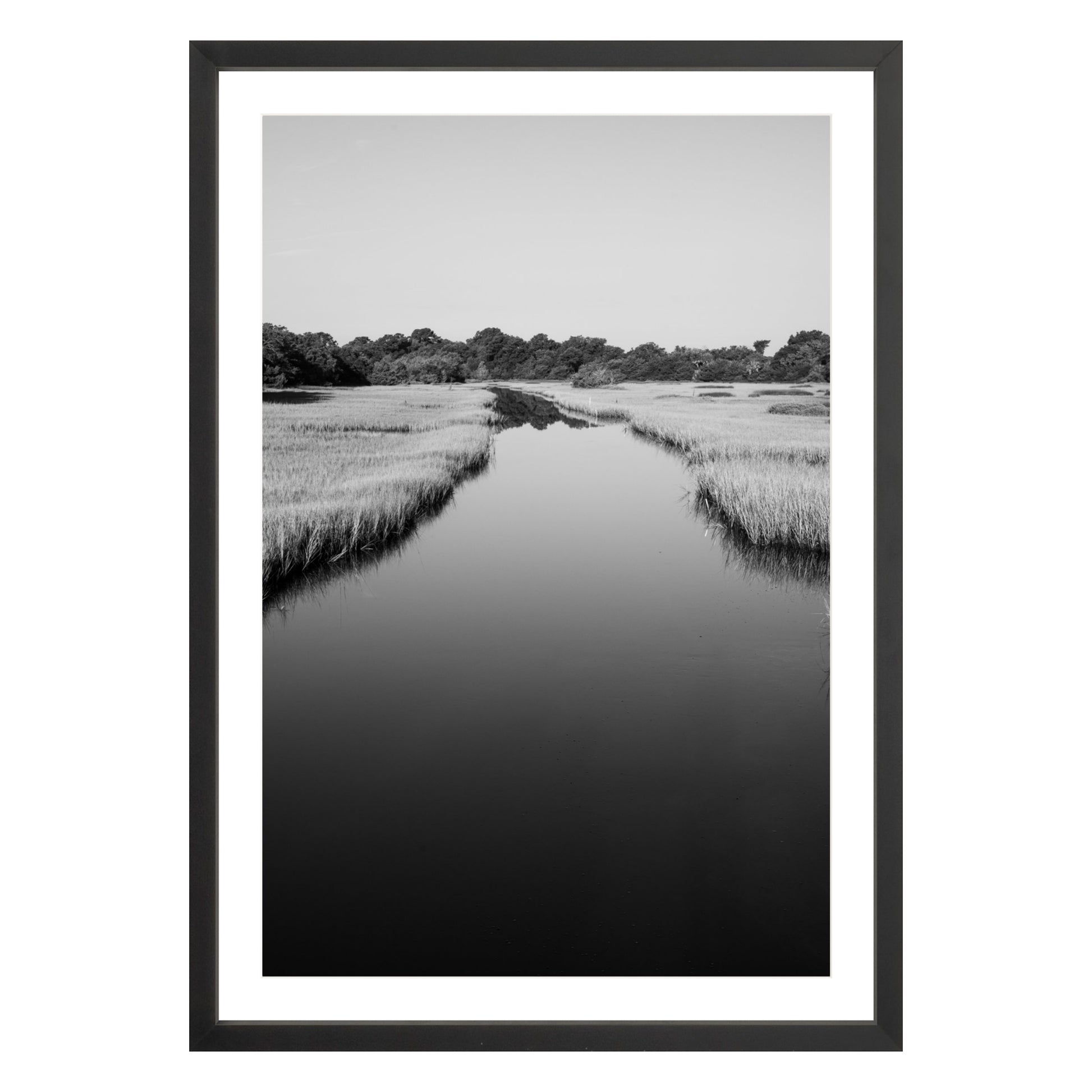 Black and white photograph of a marsh stream on Kiawah Island, South Carolina framed in black with white mat