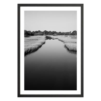 Black and white photograph of a marsh stream on Kiawah Island, South Carolina framed in black with white mat