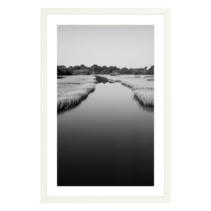 Black and white photograph of a marsh stream on Kiawah Island, South Carolina framed in white with white mat