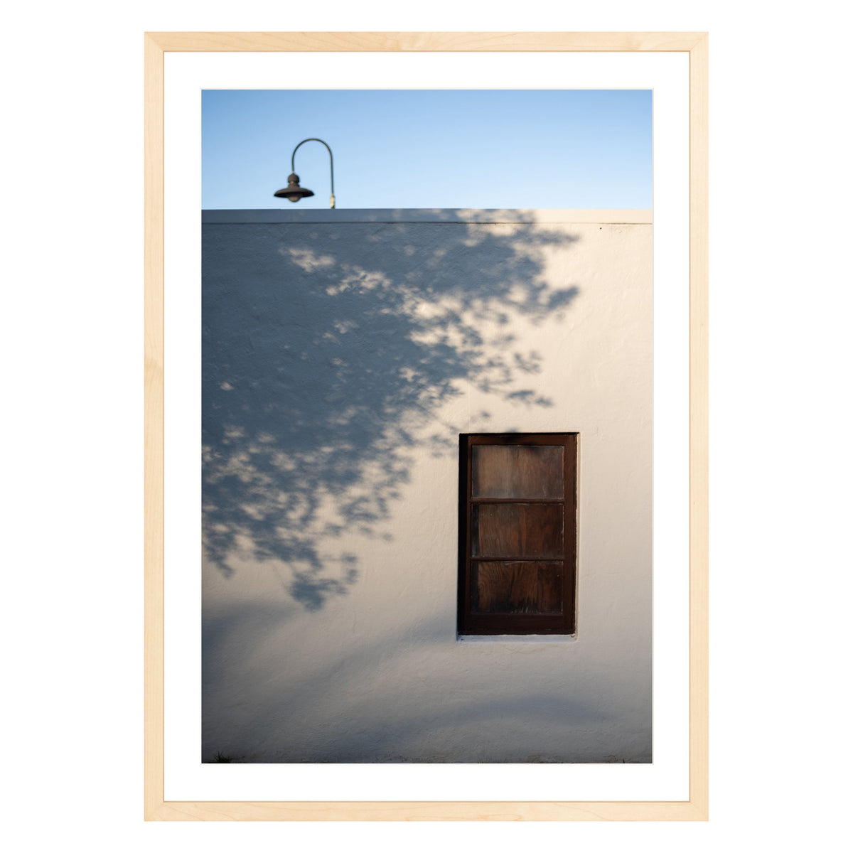 Photograph of shadows on building in San Francisco Presidio in natural wood frame with white mat