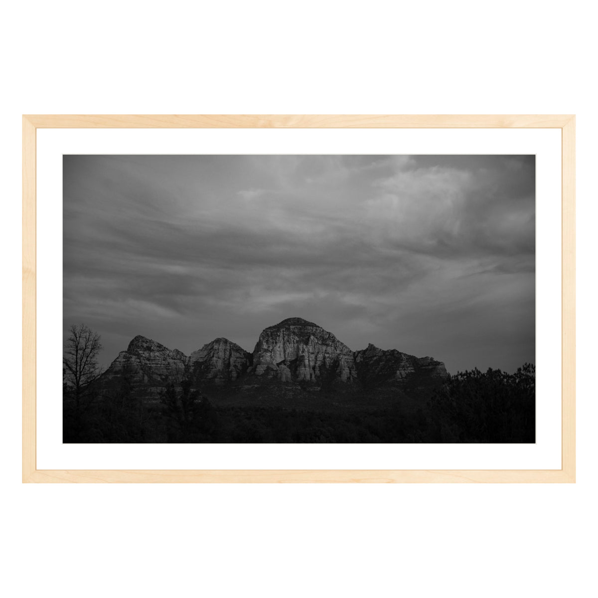 Black and white photograph of mountains in Sedona Arizona at night in a natural wood frame with white mat