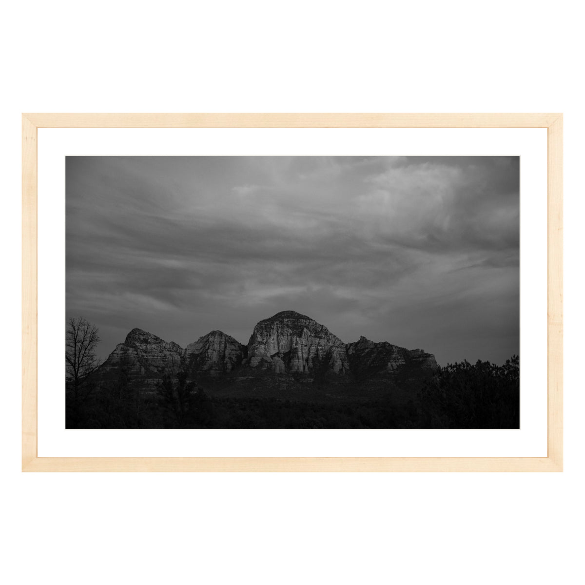 Black and white photograph of mountains in Sedona Arizona at night in a natural wood frame with white mat